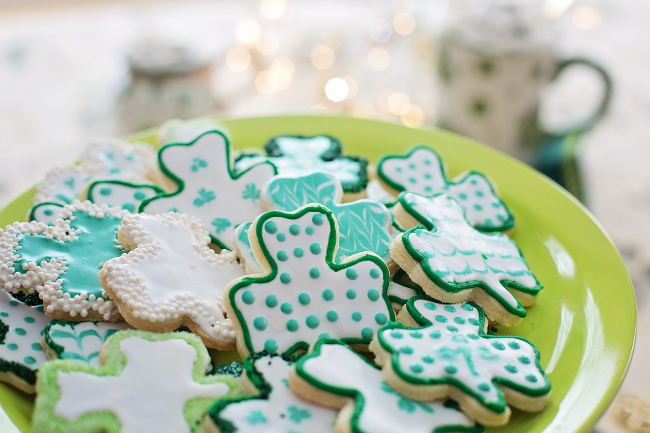 Sweet biscuits decorated as Irish shamrocks to illustrate an article on the cost of playing the Irish lottery online